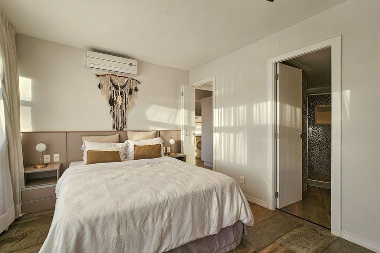 Apartamento pé na areia da praia do Tombo em Frente ao mar