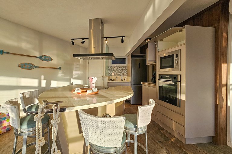 Apartamento pé na areia da praia do Tombo em Frente ao mar