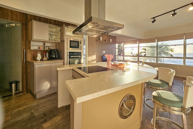 Apartamento pé na areia da praia do Tombo em Frente ao mar