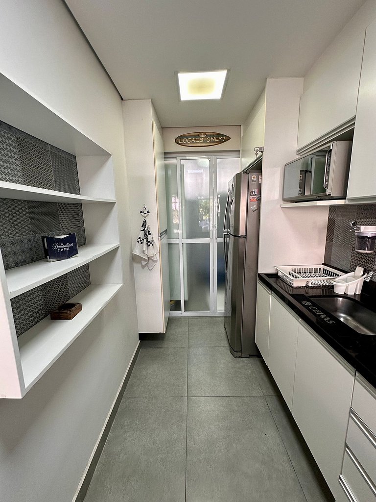 Apartamento pé na areia da praia do Tombo em Frente ao mar