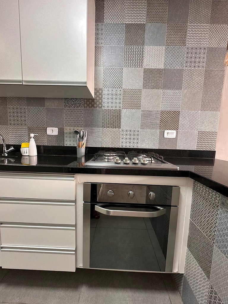 Apartamento pé na areia da praia do Tombo em Frente ao mar