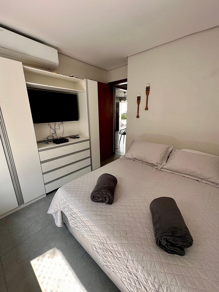 Apartamento pé na areia da praia do Tombo em Frente ao mar