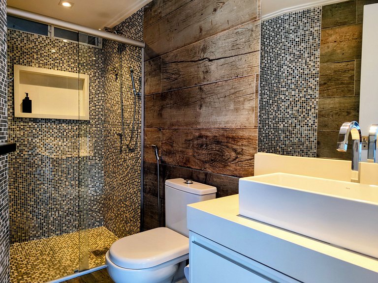 Apartamento pé na areia da praia do Tombo em Frente ao mar