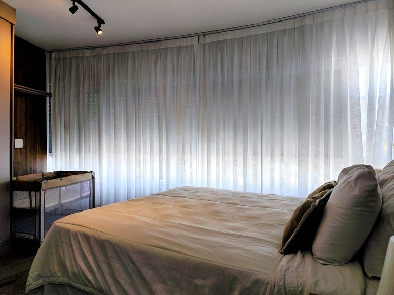 Apartamento pé na areia da praia do Tombo em Frente ao mar