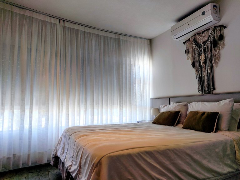 Apartamento pé na areia da praia do Tombo em Frente ao mar