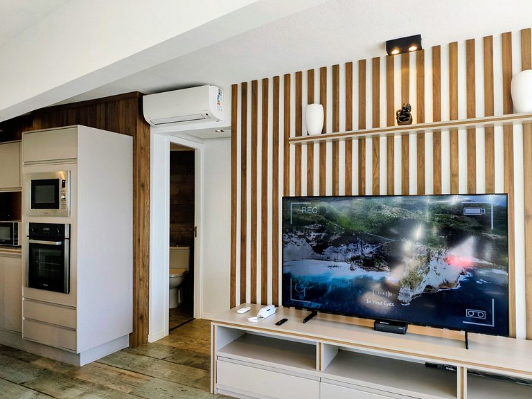 Apartamento pé na areia da praia do Tombo em Frente ao mar